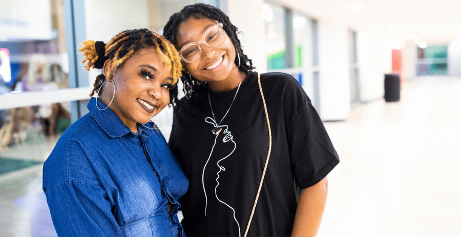 two female students smiling 